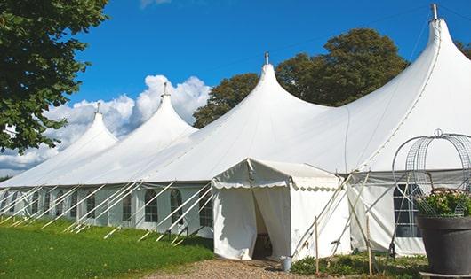 a group of luxury portable toilets with individual stalls and running water in Cranford